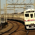 写真: 京王稲田堤駅に進入する6017Fの快速橋本ゆき
