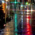 写真: 雨に けむる街角