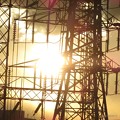写真: 鉄塔の向こうの夕陽